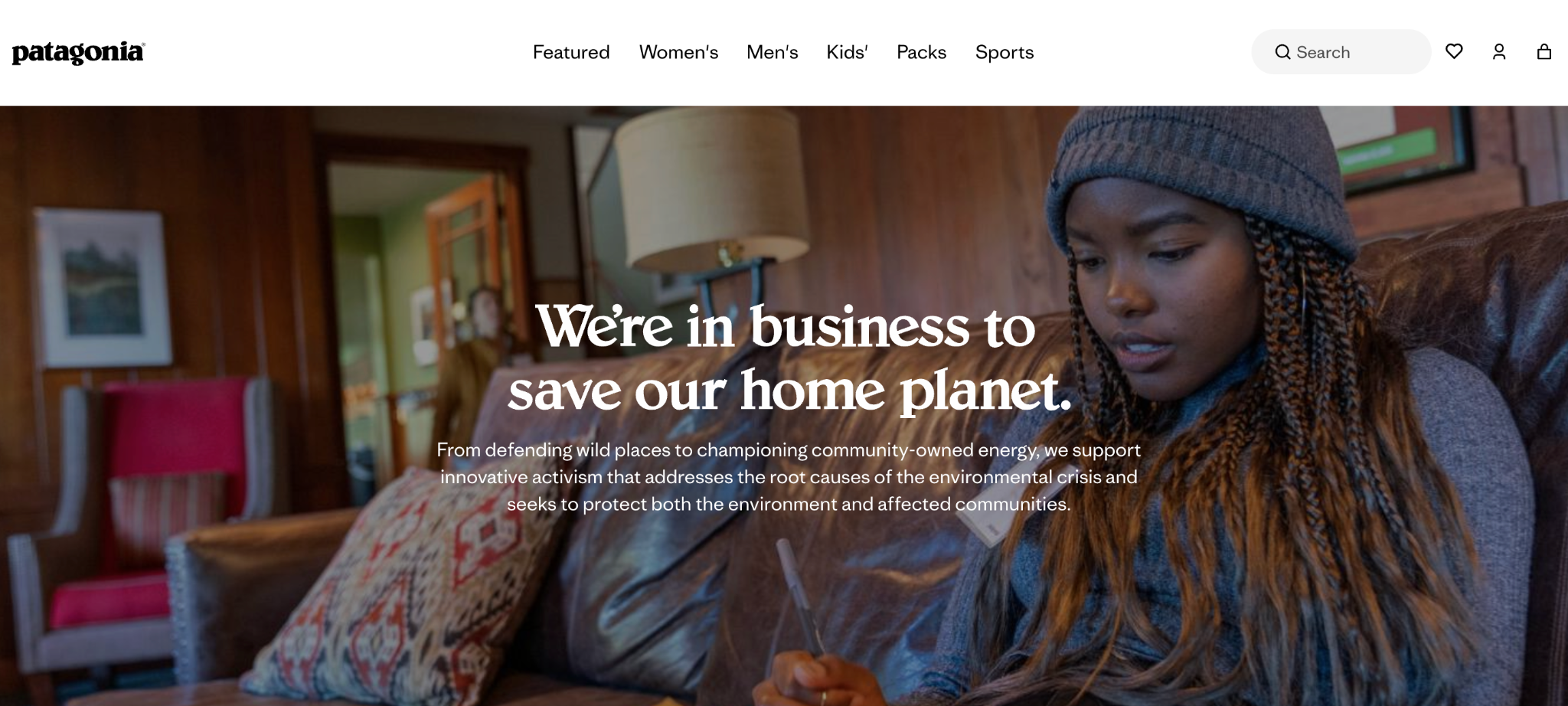 Patagonia's website hero stating 'We're in business to save our home planet' beside a portrait photo on a sofa