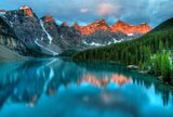 Mountain peaks reflected in a turquoise lake