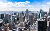 New York City skyline beneath a blue sky