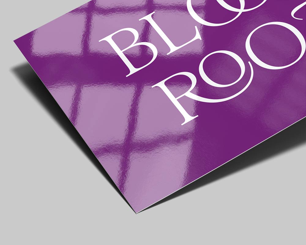 Close-up of Standard gloss business card finish showing reflective sheen and vivid color reproduction